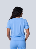 ALTA Kenzie Two-Pocket Scrub Top in Ceil Blue - back view