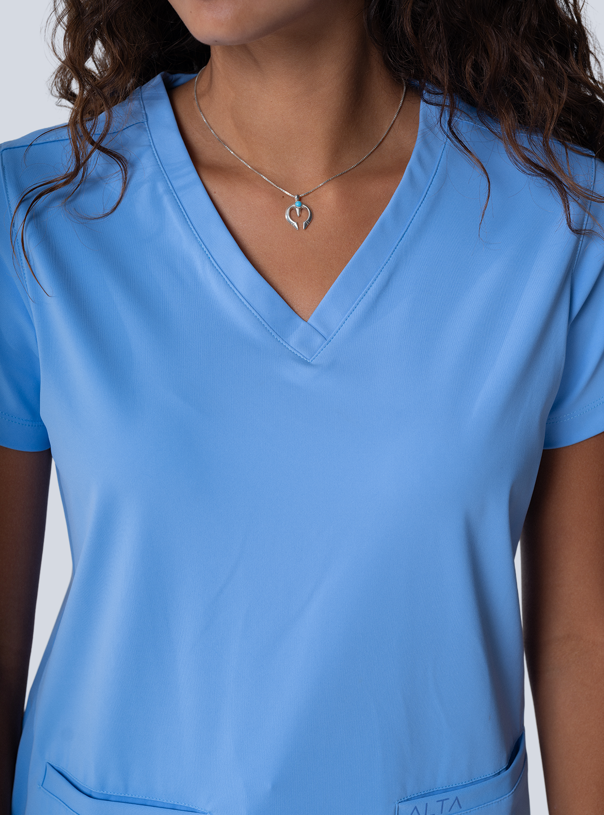 ALTA Taunya Two-Pocket Scrub Top in Ceil Blue - detail