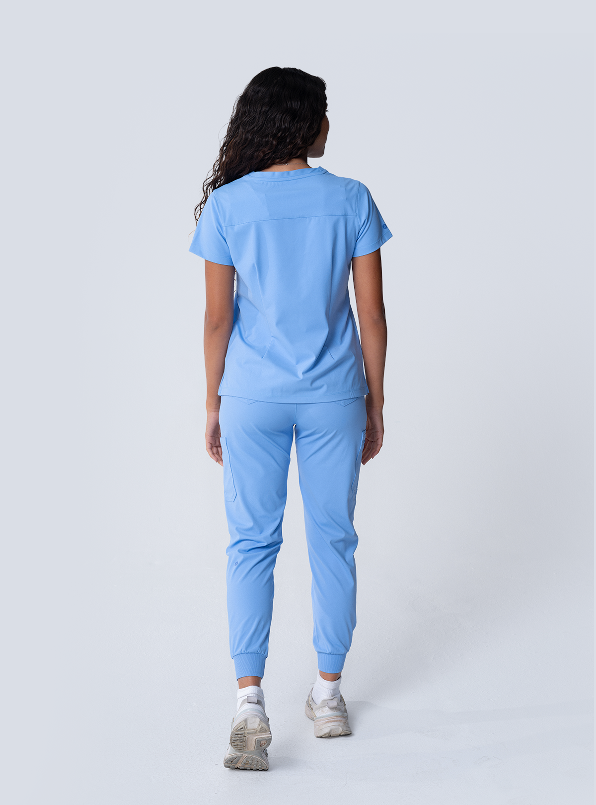 ALTA Taunya Two-Pocket Scrub Top in Ceil Blue - full back view