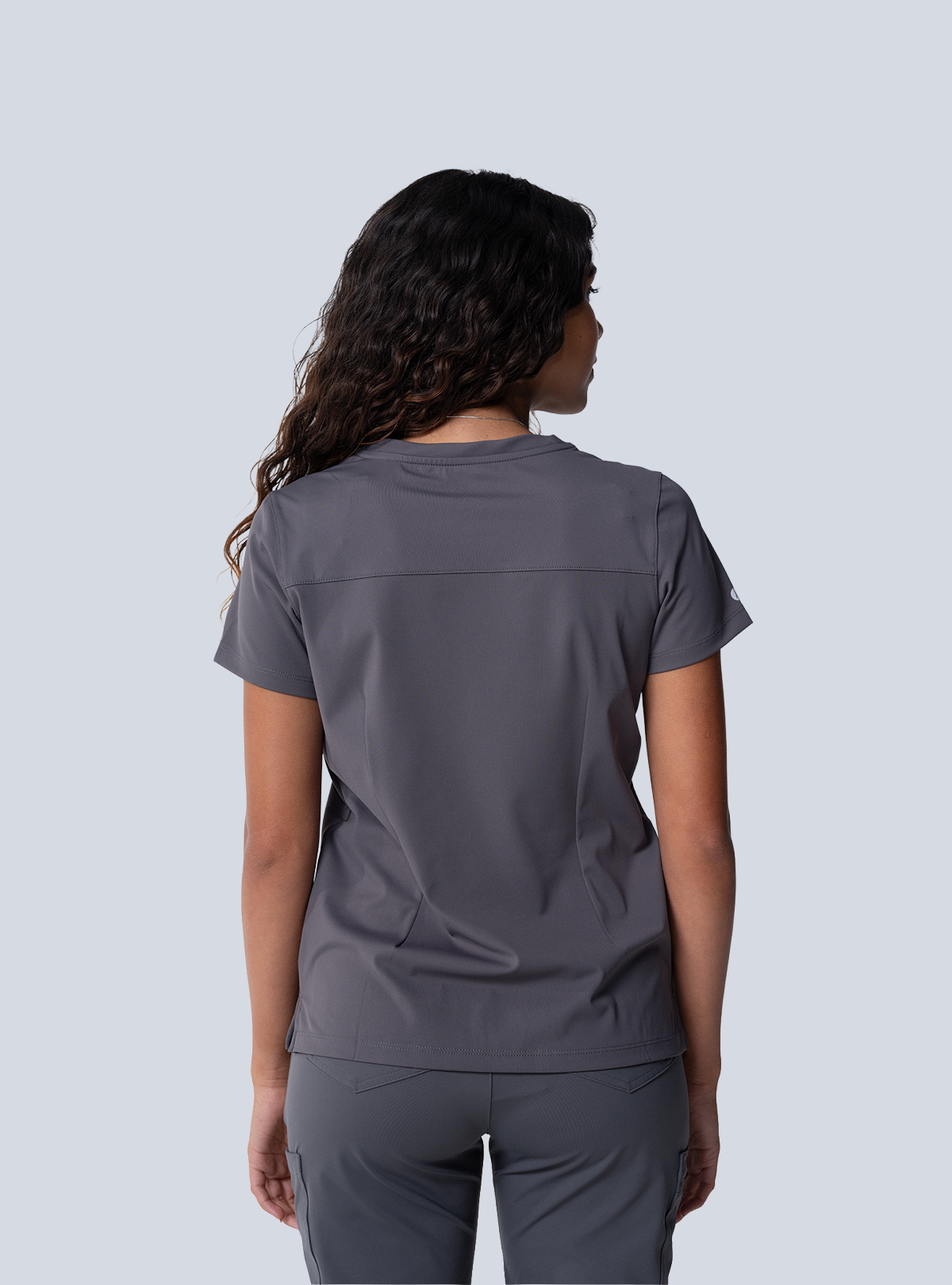 ALTA Taunya Two-Pocket Scrub Top in Grey - back view