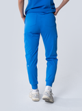 ALTA Jana Jogger Scrub Pant in Royal Blue - back view
