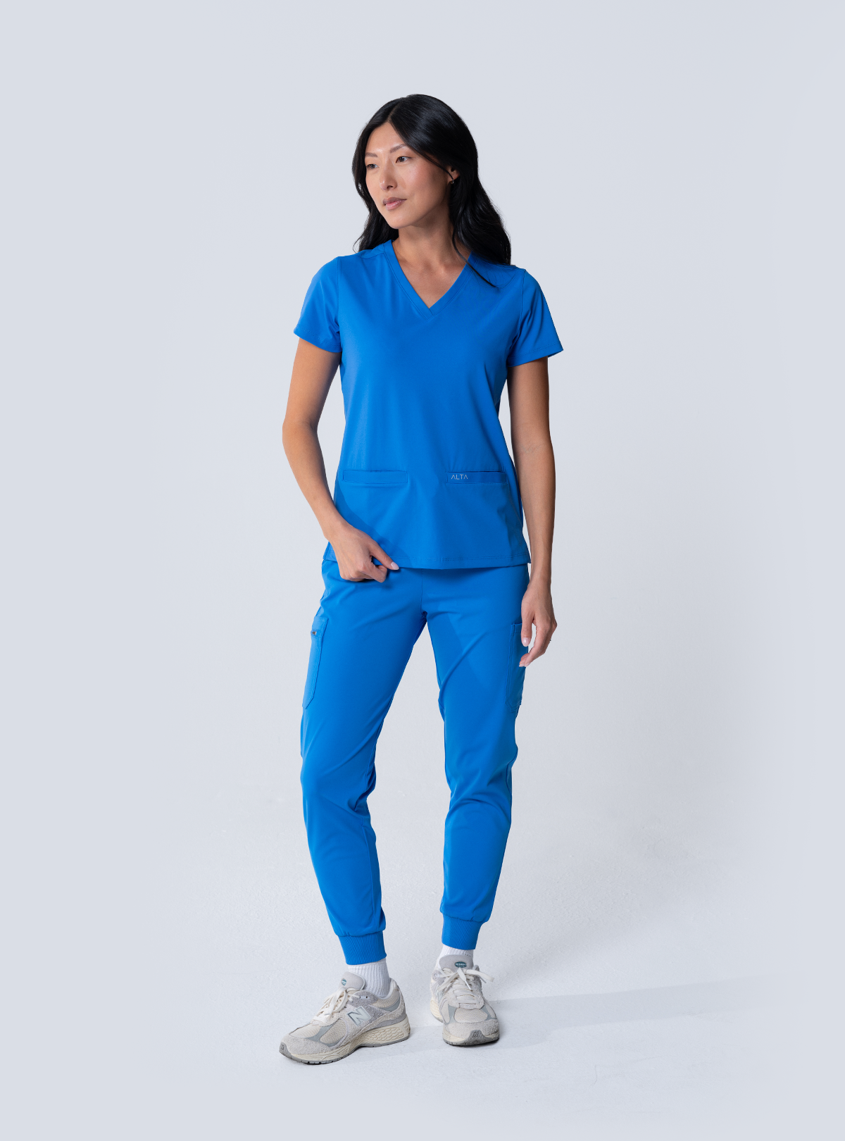 ALTA Taunya Two-Pocket Scrub Top in Royal Blue - full front view