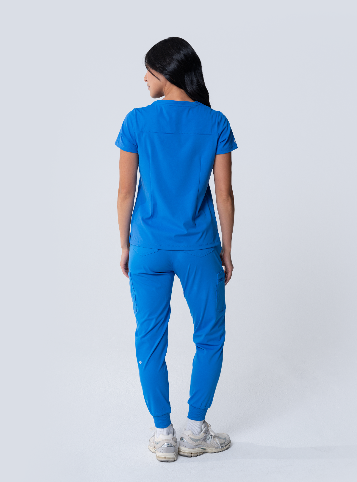 ALTA Taunya Two-Pocket Scrub Top in Royal Blue - full back view
